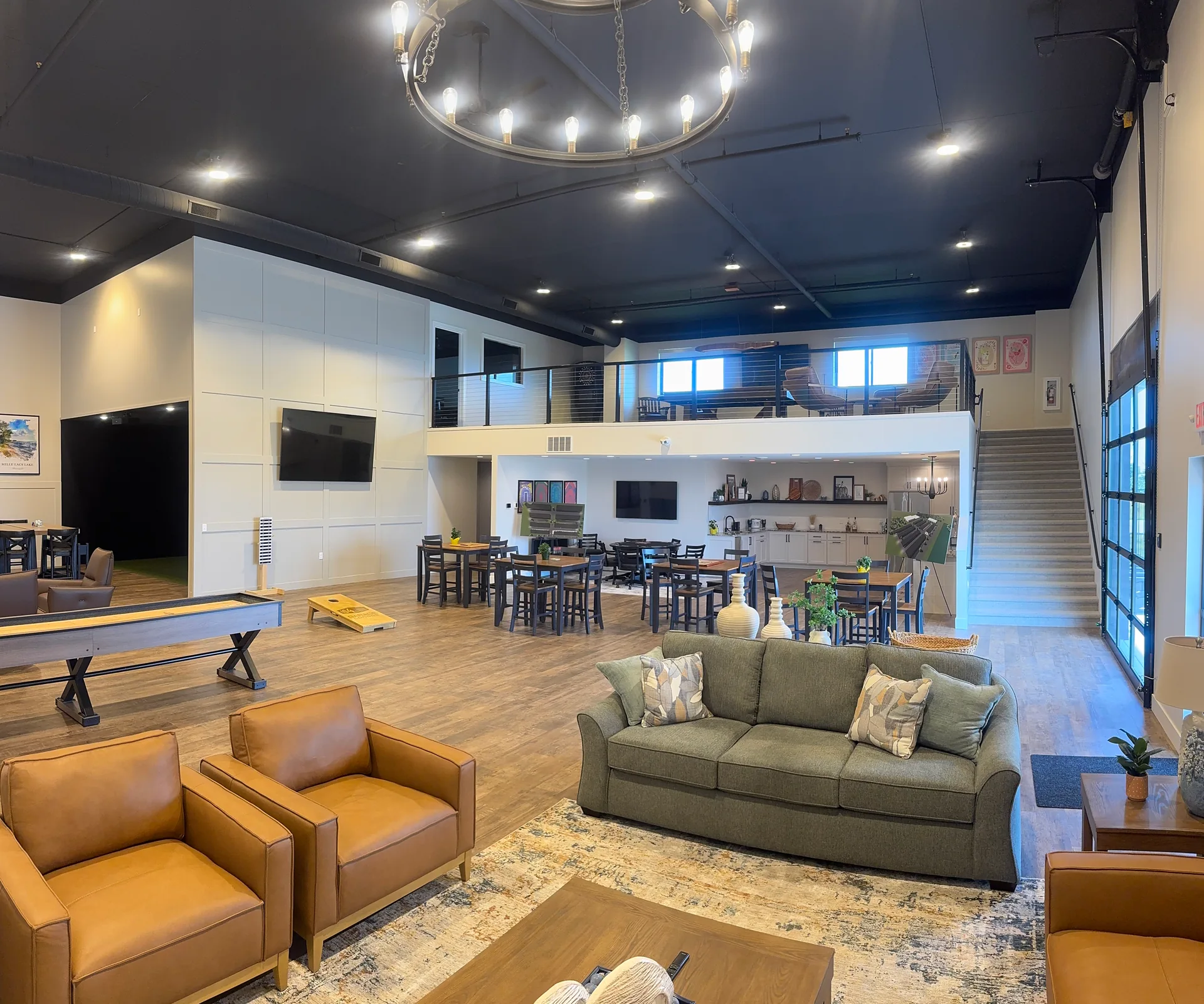 Clubhouse seating, gathering tables, kitchen and upstairs lounge